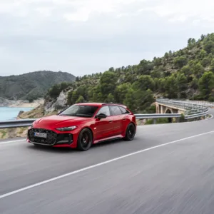 Progressiv red metallic, outdoor dynamic photo, exterior, three-quarter front view